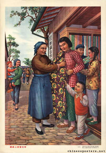 The young married woman buys a cotton print in the street