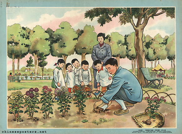 Garden worker planting flowers